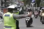 Ilustrasi-polisi-lalu-lintas-Polantas-menggelar-razia-kendaraan-bermotor.jpg