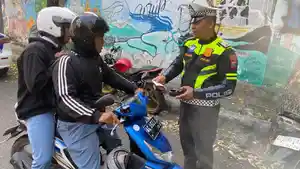 Lakukan-Penindakan-Sejumlah-motor-yang-nekat-lawan-arus-di-kawasan-Jalan-SP4-Sate.jpg