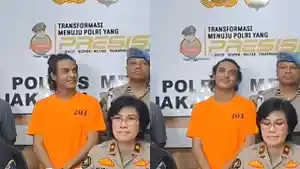 Dengan-mengenakan-baju-tahanan-berwarna-orange-dan-tangan-diborgol-Vadel-Badjide.jpg