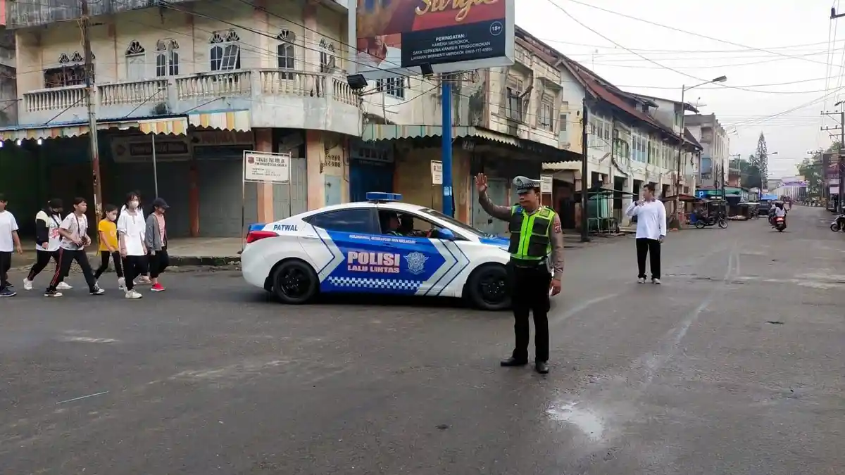 Satlantas Polres Tanjungbalai Kawal Jalan Sehat Ceria Persadabumi Vihara Bhakti Maitreya
