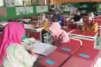 Pembagian Rapor Bergilir Ditengah Pandemi Covid-19