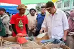 Menteri-UMKM-Maman-Abdurahman-dalam-salah-satu-kunjungannya-ke-pasar-tradisional.jpg