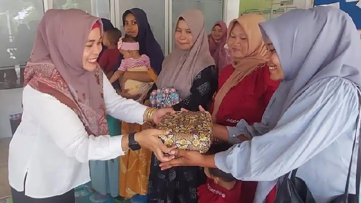 Junianti- M Aiyub Juara Pada Ajang Pemilihan Orang Tua Hebat di Lhokseumawe