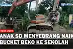 Jembatan-Belum-Selesai-Anak-SD-Ini-Menyebrang-Naik-Bucket-Beko-saat-Berangkat-ke-Sekolah.jpg