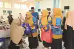 PGMNI Aceh Bagikan Paket Berbuka untuk Abang Becak hingga Pasien RSUZA
