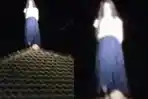 Heboh-Perempuan-Berbaju-Putih-dan-Rok-Panjang-Berdiri-dan-Tertawa-di-Atas-Genteng-Saat-Malam-Hari.jpg