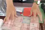 Uang-Hasil-Rampokan.jpg