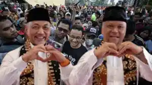 Paslon-Syaikhu-Ilham-berlatar-Anies-Baswedan-dan-Anak-Abah.jpg