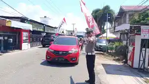 POLANTAS-Seorang-anggota-polantas-Kota-Gorontalo-mengantur-lalu-lintas-Sabtu-28-Maret-2026.jpg