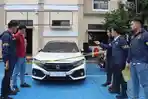 20260519_barang-bukti-kasus-pembakaran-mobil-Honda-Civic-Turbo-milik-Kades-Hoho_1.jpg