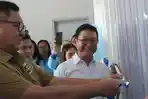 Wakil-Bupati-Minahasa-Selatan-Theo-Kawatu-saat-meresmikan-SPPG-Ongkaw-I.jpg