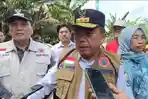 Gubernur-Jambi-Al-Haris-turun-ke-lokasi-yang-terdampak-banjir.jpg