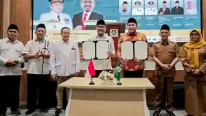 Bupati-Pasuruan-Rusdi-Sutejo-saat-menghadiri-penandatanganan-adendum-kesepakatan-kerja-sama.jpg