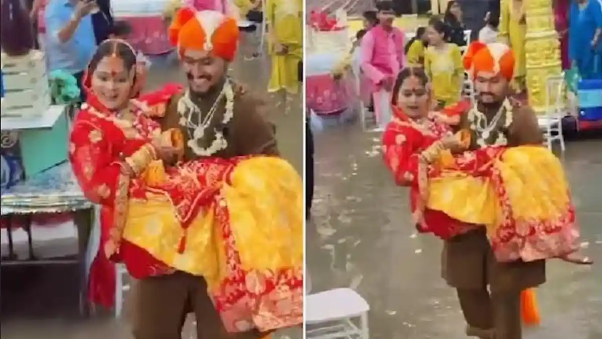 Hujan Deras, Pengantin Pria Gendong Mempelai Wanita Lewati Banjir demi Lanjutkan Upacara Pernikahan