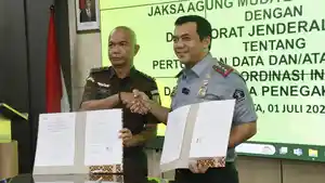 Direktur-Jenderal-Imigrasi-Silmy-Karim-menandatangani.jpg