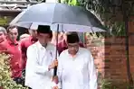 presiden-joko-widodo-memayungi-quraish-shihab.jpg