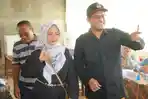 Ketua-KPU-Kota-Pariaman-bersama-istri-melakukan-pencoblosan-PSU-DPD-RI.jpg