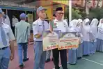 Kepala-Sekolah-MAN-1-Medan-memberikan-apresiasi-kepada-Muhammad-Hafis.jpg