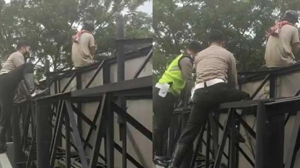 Pria di Surabaya Panjat Reklame Sambil Gendong Boneka, Berakhir dengan Air Mata Haru di Mapolsek