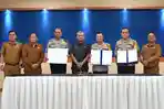 Pj-Bupati-Deli-Serdang-Wiriya-Alrahman-dan-jajaran-Polres-melakukan-penandatanganan-NPHD.jpg