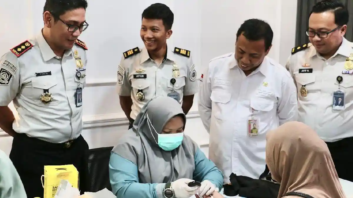 Imigrasi Hadir untuk Rakyat, Gelar Layanan Kesehatan Gratis dan Baksos di Tanjungpinang - Tribunbatam.id