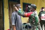 TNI Gelar Bakti Sosial Bagikan Sembako Kepada Masyarakat Masamba