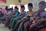 sejumlah-anak-yang-menjadi-peserta-sunatan-massal-ccai_20180709_175919.jpg