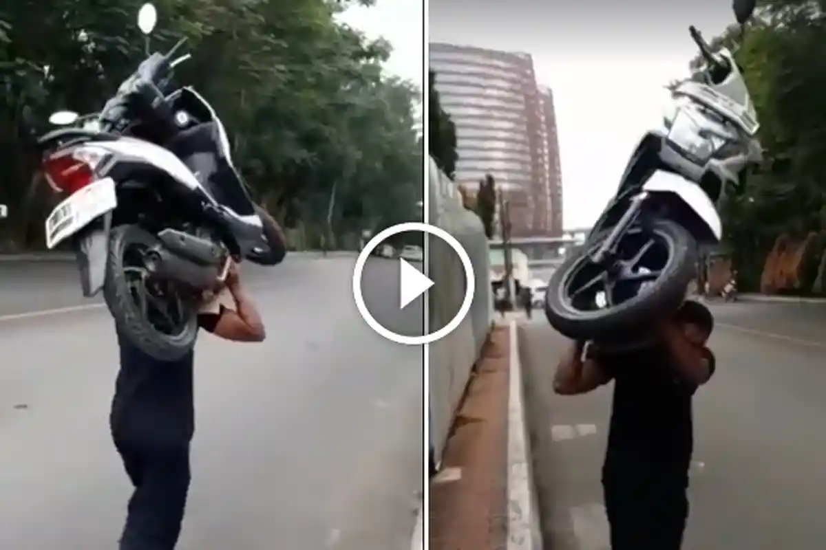 Viral, Video Satpam Memanggul Sepeda Motor yang Diparkir Sembarangan, Netizen Beri Pujian