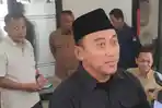 Ketua-KPU-Kabupaten-Nganjuk-Arfi-Musthofa-saat-menjelaskan-tahapan-Pilkada-2024.jpg