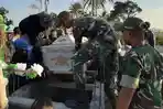 anggota-satgas-yonif-132bs-membantu-prosesi-pemakaman.jpg