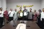 M-Hendra-Supardi-serta-Direktur-Pengembangan-Produk-dan-Ekosistem-PosSaku-2026.jpg