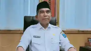 Kepala-Disdik-OKI-Muhammad-Refly.jpg