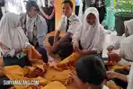 Tim-visitasi-Kemenpan-RB-mengunjungi-SMPN-2-Malang-terkait-inovasi-SIMBA-ASIA-Selasa-2372024.jpg