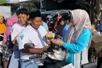 TKD-Prabowo-Gibran-Bagikan-Makan-Siang-dan-Susu-Gratis-di-Ponorogo.jpg