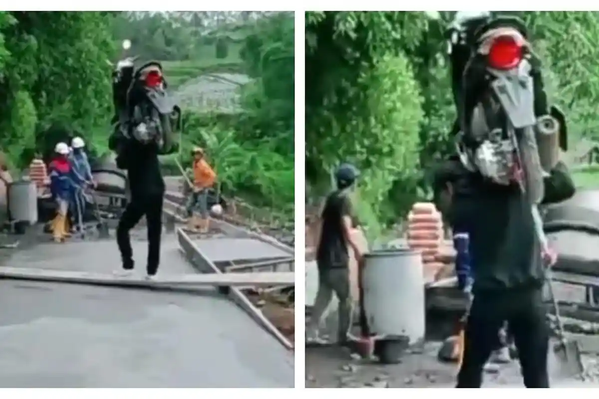 Agak Laen, Pria Ini Panggul Motornya Karena Takut Jalan yang Dicor Rusak