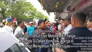 Petugas-Dishub-dan-seorang-warga-Komplek-J-City-ribut-akibat-parkir-berlangganan.jpg