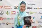 Tulis Belasan Buku, Dini Lestari Buktikan Cerebral Palsy Bukan Penghalangnya untuk Berkarya