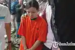 jatim/Tersangka-penganiaya-anak-selebgram-IPS-alias-Indah-27-saat-digelandang-polisi.jpg