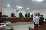 SIDANG-UANG-PALSU-Terdakwa-John-Biliater-Panjaitan-saat-menjadi-saksi-untuk-terdakwa.jpg