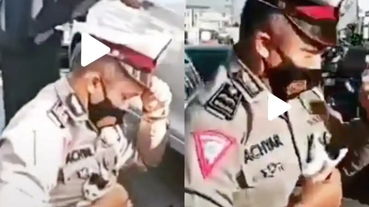 VIDEO VIRAL Polisi Menyelamatkan Kucing Nyaris Tergilas Langsung Didekap, Warganet: Naikan Pangkat