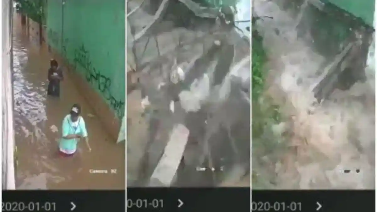 Momen Menegangkan 2 Orang Selamat dari Reruntuhan Tembok Besar Saat Banjir