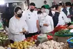 Gubernur-Sumut-Bobby-Nasution-dan-Ketua-TP-PKK-Kahiyang-Ayu-saat-meninjau-pasar-1.jpg