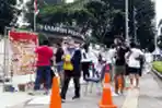 Melukis di Tengah Gelaran Hari Bebas Kendaraan Bermotor
