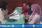 suasana-daftar-ulang-bagi-siswa-yang-diterima-di-jalur-reguler-online-di-smpn-9-kota-malang_20180712_184412.jpg