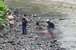 petugas-saat-melakukan-evakuasi-penemuan-mayat-perempuan-di-sungai-yeh-empas-tabanan.jpg