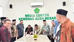 perjanjian-kerja-sama-antara-Disdukcapil-Kabupaten-Aceh-Besar-dan-Kemenag-Aceh-Besar-2026.jpg