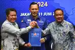 Herman-Deru-dan-Cik-Ujang-Saat-Menerima-Rekomendasi-dari-Partai-Demokrat.jpg