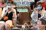 penumpang-mengenakan-masker-untuk-melindungi-diri-dari-penyebaran-covid-19.jpg