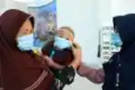 Warga Natuna Gunakan Masker Saat Jalani Aktivitas Sehari-hari