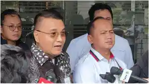 Juru-Bicara-Satgas-PKH-Barita-Simanjuntak-kiri.jpg
